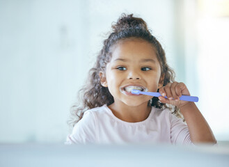Girl, brushing teeth and smile for hygiene, clean mouth and fresh breath for oral care and dental health. Child, cleaning and toothpaste with toothbrush, bathroom and wellness in family home