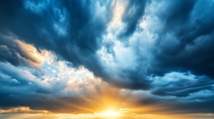 Obraz premium Dark clouds with the sun breaking through stormy weather