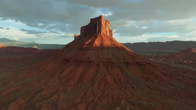 Aerial imagery above Moab desert scene with rocky outcrops and Mesa in 4K
