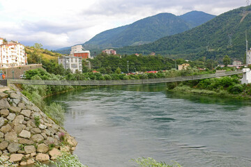 Fototapeta premium Natural river water flowing through greenery