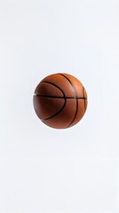 Obraz premium Minimalist Basketball Floating Against Crisp White Background