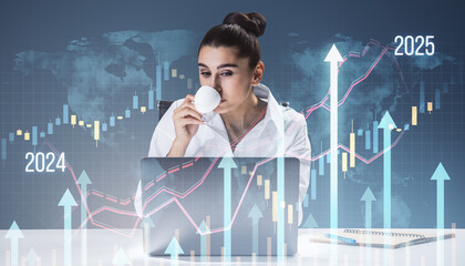 Businesswoman drinking coffee at desk with financial charts overlay.