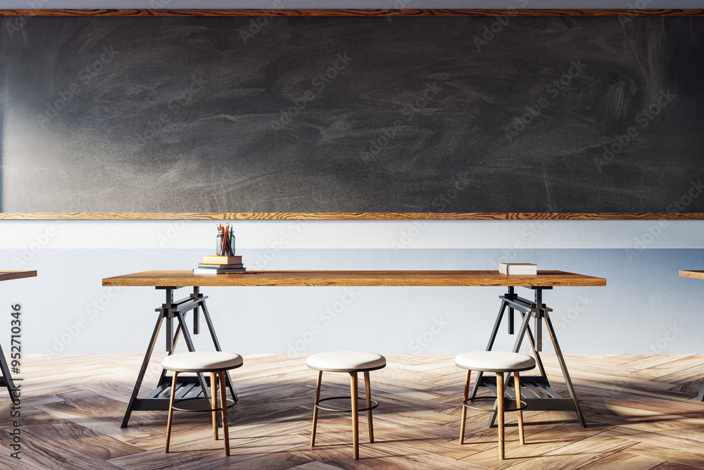 Aufkleber modern classroom interior with empty wooden desks and a large blackboard. 3d rendering