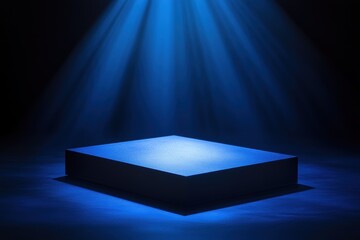 Mysterious blue spotlight on black platform in dark ambiance