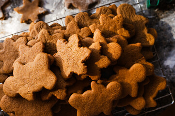 A batch of freshly baked gingerbread cookies cooling on a wire rack