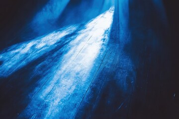 Enigmatic blue light beams on textured floor