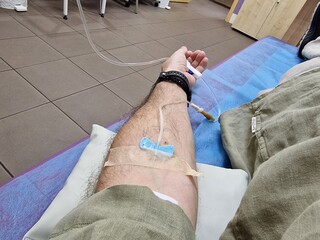 a patient is given an IV drip in a hospital