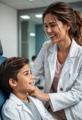 Obraz premium A female doctor smiles warmly while interacting with a young patient in a hospital, highlighting care and professionalism.