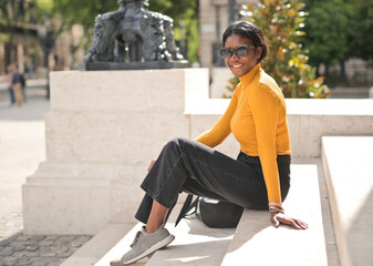 portrait of a young woman ona  a stairs in the street