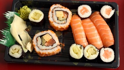Sushi artfully arranged on plate, exemplifying creative food styling. Composition highlights attention to detail and aesthetic appeal, making it ideal for gourmet dining 