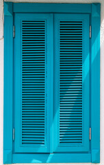 Old blue wooden shutter