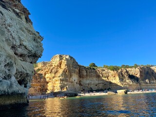 Oddly shaped jagged rock formations and cliffs at Lagoa Beach, Faro District, Southern Portugal.