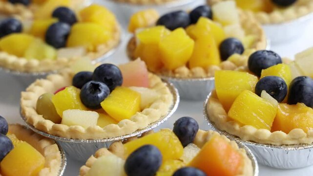 Fresh fruit tart desserts with blueberries, close up establisher