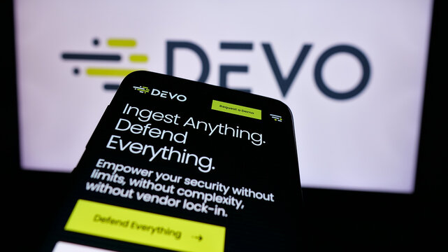 Stuttgart, Germany - 08-27-2024: Mobile phone with website of US security data platform company Devo Technology Inc. in front of business logo. Focus on top-left of phone display.