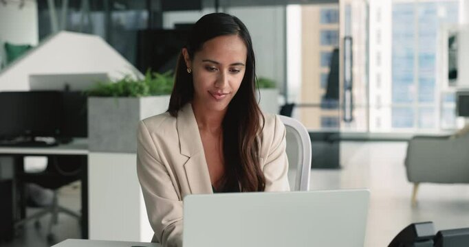 Female office employee using laptop, check written information in personal organizer working in modern coworking, check emails, respond to urgent messages, review schedule and prioritize tasks for day