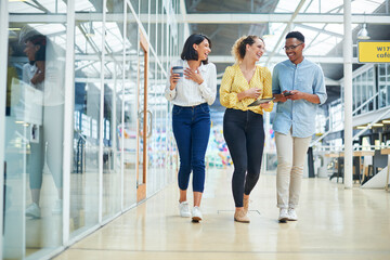 Walking, discussion and business people in office laughing, bonding and talking on lunch break....