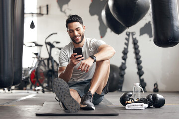 Fitness, smartphone and man in gym, typing and internet with influencer, connection and texting. Person, guy and athlete in wellness center, social media and message with contact and communication