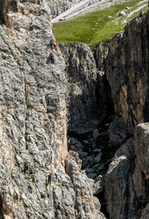 Climbers engaged on a vertical rock face near the Vajolet refuge 