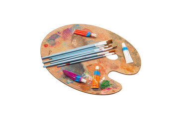 Artistic wooden palette with colorful paints and brushes for creative activities. Horizontal. PNG
