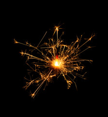 Christmas sparkler burning isolated on black background...