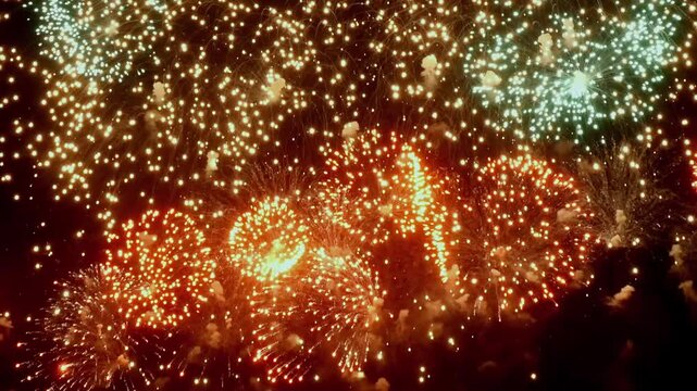 Brilliant colors illuminate the night as fireworks explode in slow motion, creating a mesmerizing display of light and energy against the dark backdrop.