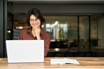 Young happy professional business woman executive working on computer technology in office, busy...