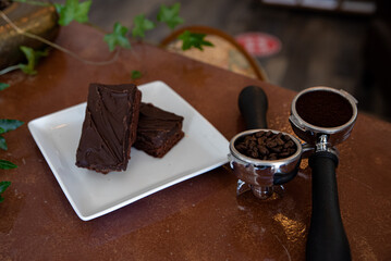 Coffee Shop Brownie Pastry with Coffee Beans on Table