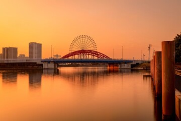名古屋市、朝焼けの中川橋と名古屋港水族館の観覧車