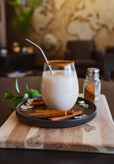 Horchata with cinnamon and coffee in a glass in Coffee Shop