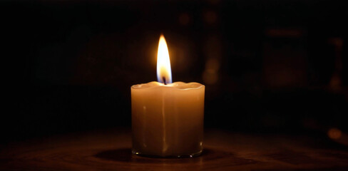 Single Candle Flame Illuminating Dark Space