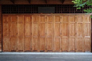 A full-frame view of traditional wooden panel doors showcasing a classic design.