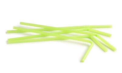 Green plastic straws on white background