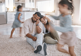 Stress, family and parents with children running, playing game and noise in home. Depression, mother and father with kids with energy, autism and tired of hyperactive people with motion blur on floor