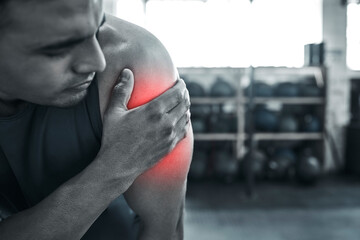 Man, fitness and arm pain with red glow at gym with muscle tension or strain on weightlifting. Male...