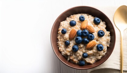 served healthy breakfast barley porridge with blueberries and almonds