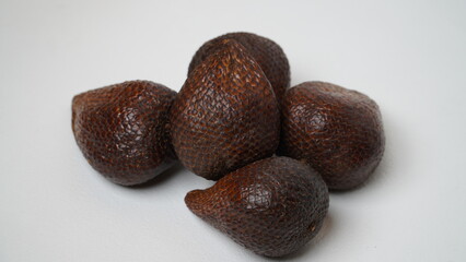 Fresh ripe salak fruit or snakefruit isolated on white background