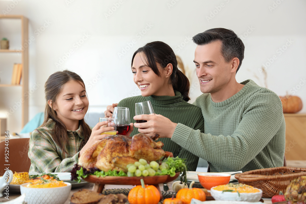 Canvas Prints little girl with her parents having dinner at festive table on thanksgiving day