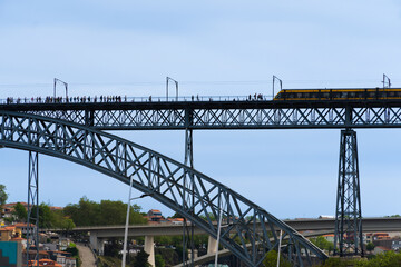 View of Porto city and Douro river and Dom Luis bridge. Porto, Vila Nova de Gaia, Portugal. Cityscape along the river