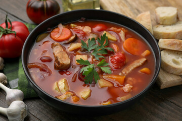Tasty homemade stew with vegetables on wooden table, closeup