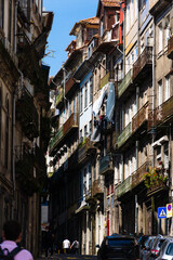 Fototapeta premium View of the city of Porto. Characteristic architecture of Porto, Vila Nova de Gaia, Portugal. Urban landscape along the river. Houses and buildings