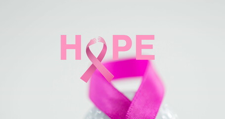 Image of breast cancer awareness text over pink breast cancer ribbon