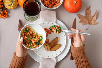 Woman having Thanksgiving dinner at table, top view