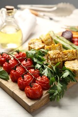 Delicious grilled vegetables with spices on white table