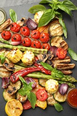 Delicious grilled vegetables with spices on grey table, flat lay