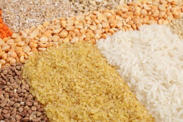 Different types of cereals and lentils as background, closeup