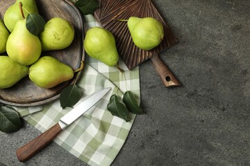Many fresh ripe pears and knife on grey table, top view. Space for text