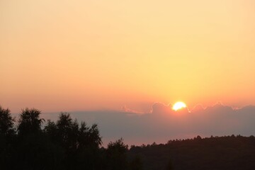 Beautiful view of sky over meadow at sunrise in morning