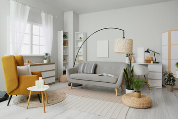 Armchair, sofa and big lamp in living room