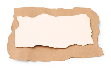 Pieces of old paper with dark burnt borders isolated on white