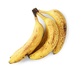 Bunch of ripe bananas with dark spots isolated on white, top view